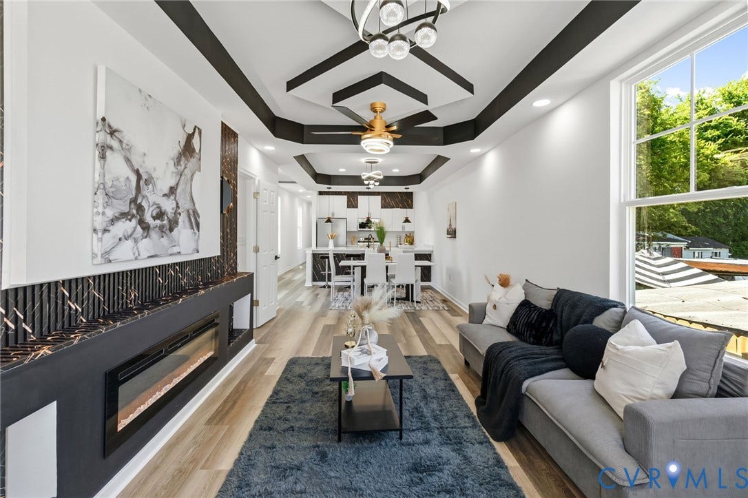 516 S South Street, Myers, Petersburg, VA 23803 Recessed lighting, wood-finish flooring, and a modern linear fireplace with a stone surround