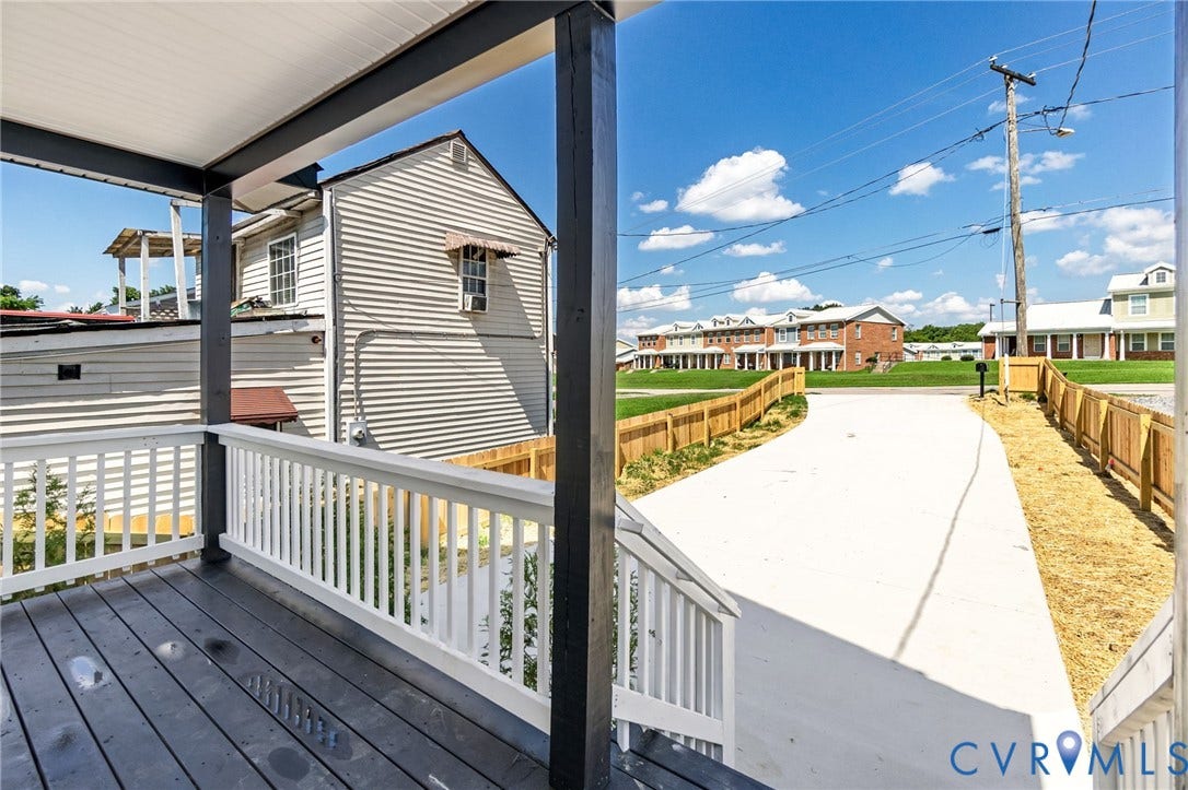516 S South Street, Myers, Petersburg, VA 23803 Covered front porch with dark wood-finish decking and white railings
