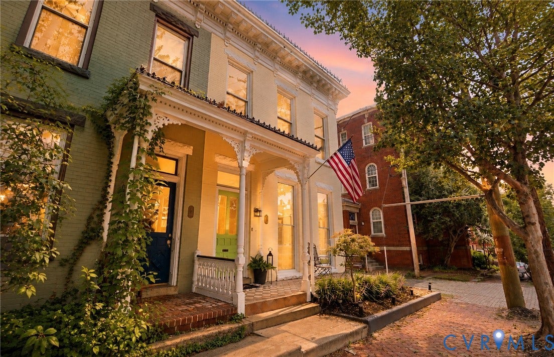 109 N Morris Street, The Fan, Richmond, VA 23220 Brick exterior with decorative white porch railings, covered entry, and a contrasting green front door