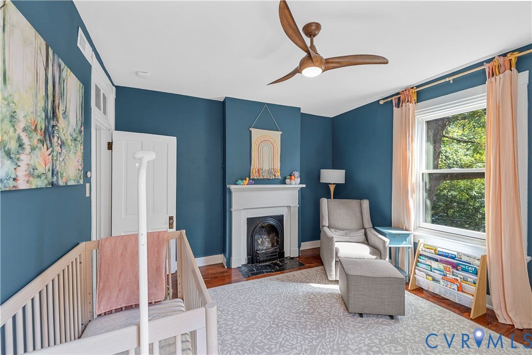 109 N Morris Street, The Fan, Richmond, VA 23220 Wood-finish flooring, a ceiling fan with integrated lighting, and a window with trim