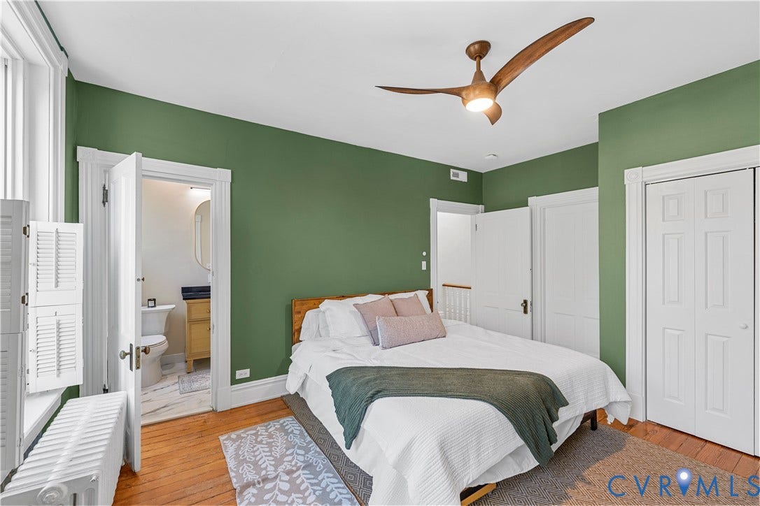 109 N Morris Street, The Fan, Richmond, VA 23220 Hardwood flooring throughout, with a ceiling fan, bifold closet doors, and an en-suite bathroom featuring a vanity with a vessel sink