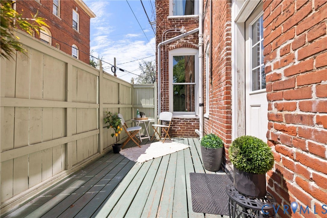 109 N Morris Street, The Fan, Richmond, VA 23220 Red brick exterior with white trim windows and a white paneled door