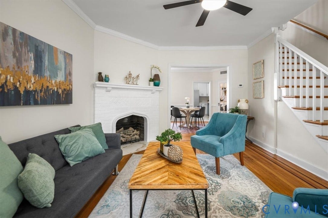 3510 Hanover Avenue, Museum District, Richmond, VA 23221 Hardwood flooring, white fireplace, painted brick hearth, crown molding, and a ceiling fan