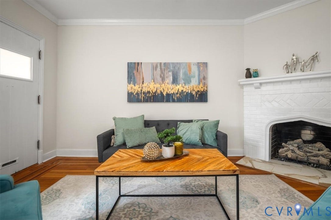 3510 Hanover Avenue, Museum District, Richmond, VA 23221 Hardwood flooring, painted brick fireplace with hearth, white crown molding, and white door with glass panel