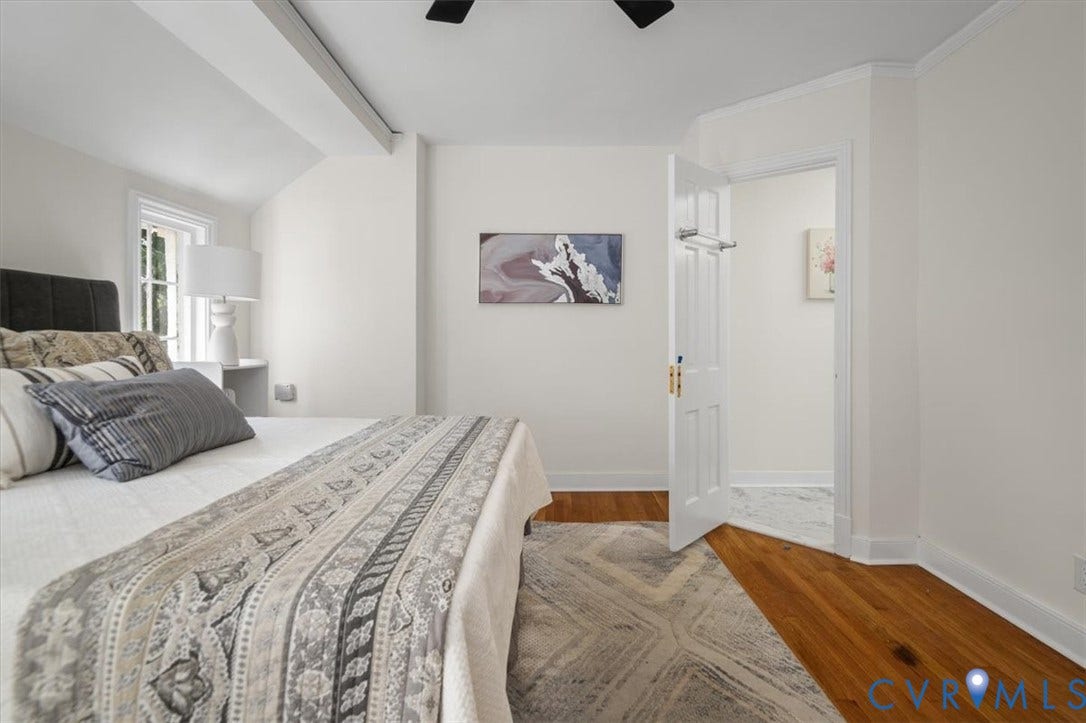 3510 Hanover Avenue, Museum District, Richmond, VA 23221 Hardwood flooring, painted white walls, recessed window, exposed ceiling beam, and crown molding