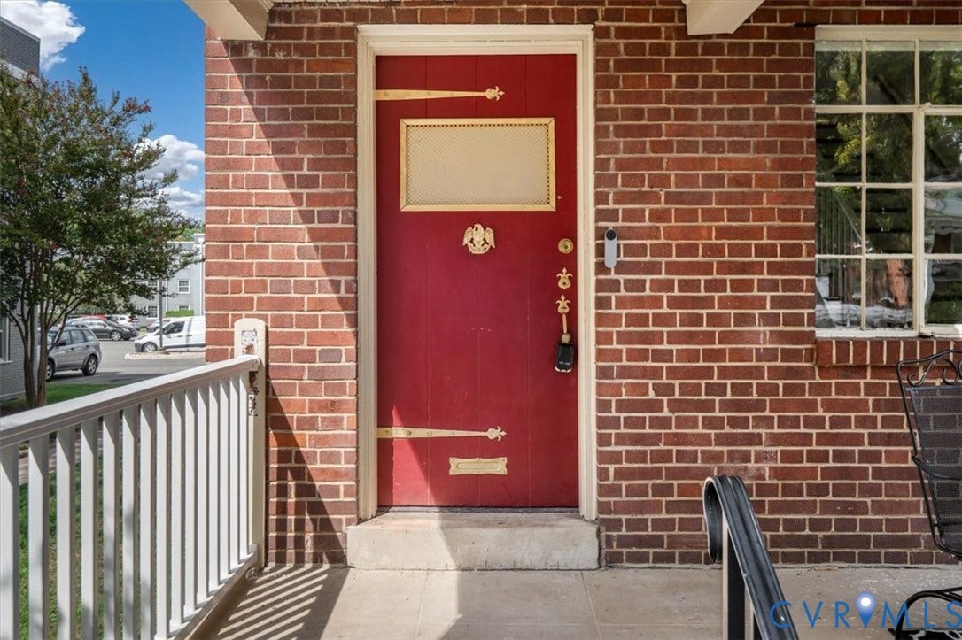 3510 Hanover Avenue, Museum District, Richmond, VA 23221 Brick exterior facade featuring a red entry door with decorative hardware