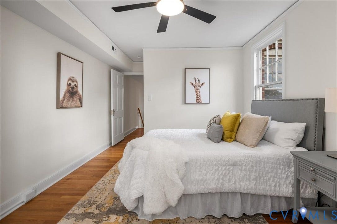 3510 Hanover Avenue, Museum District, Richmond, VA 23221 Wood-finish flooring, white painted walls, ceiling fan with integrated lighting, and a double-hung window