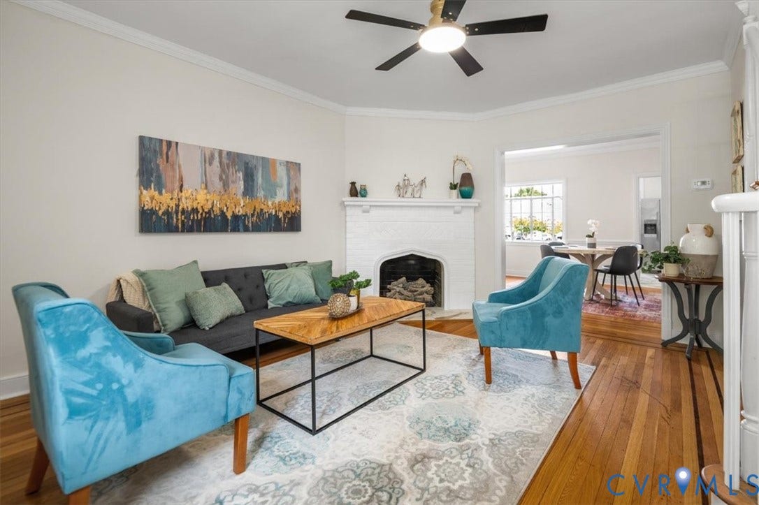 3510 Hanover Avenue, Museum District, Richmond, VA 23221 Living area featuring hardwood flooring, a ceiling fan with integrated lighting, a decorative fireplace, and crown molding