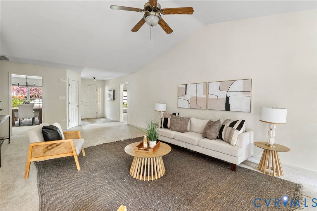3173 Poplar View Place, Ashley Forest, Chester, VA 23831 Vaulted ceiling with ceiling fan, light-colored wall paint, white trim, and a white paneled entry door