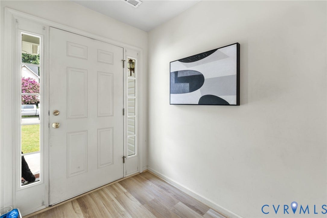 3173 Poplar View Place, Ashley Forest, Chester, VA 23831 Entryway featuring a paneled door with glass sidelights and wood-finish flooring