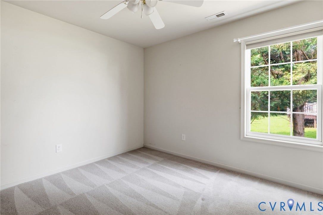 3173 Poplar View Place, Ashley Forest, Chester, VA 23831 Wall-to-wall patterned carpeting, neutral wall finishes, and a multi-pane window
