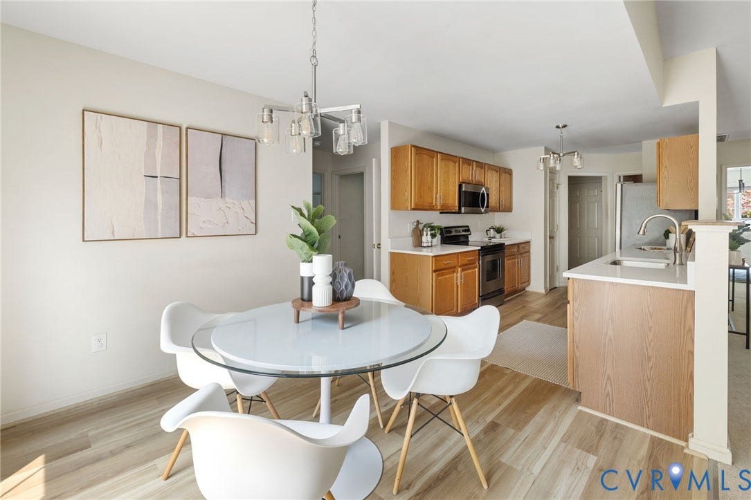 3173 Poplar View Place, Ashley Forest, Chester, VA 23831 Hardwood-finish flooring, recessed lighting, and a kitchen featuring wood cabinetry, stainless steel appliances, and a peninsula with countertop seating