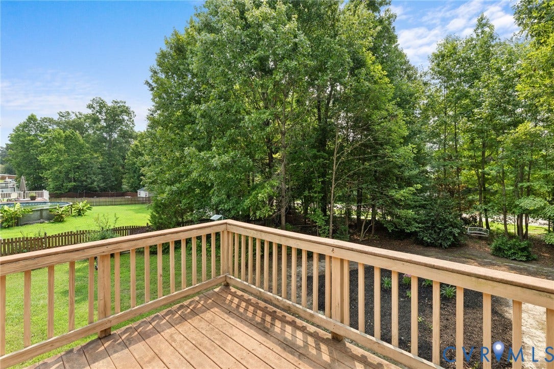 3173 Poplar View Place, Ashley Forest, Chester, VA 23831 Expansive wood deck with a natural finish, featuring a surrounding wood railing