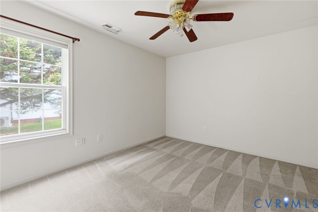 3173 Poplar View Place, Ashley Forest, Chester, VA 23831 Neutral carpeting with visible pattern, white walls, and a ceiling fan with wood-finish blades