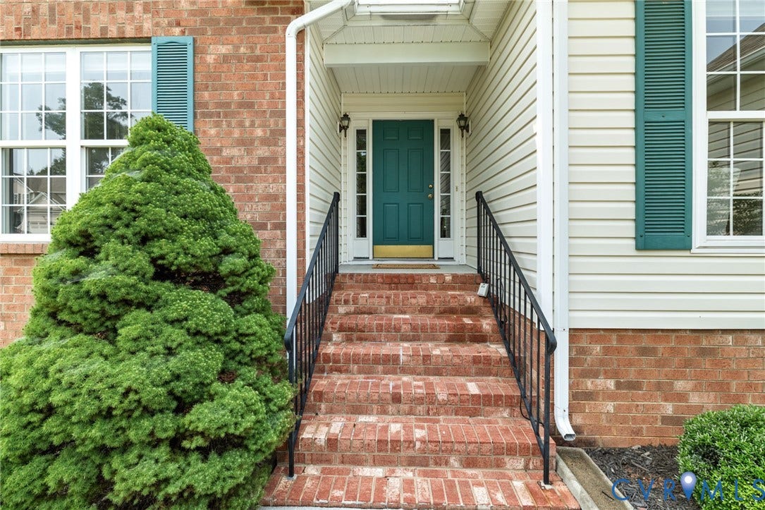 3173 Poplar View Place, Ashley Forest, Chester, VA 23831 Brick exterior with white window frames and green shutters