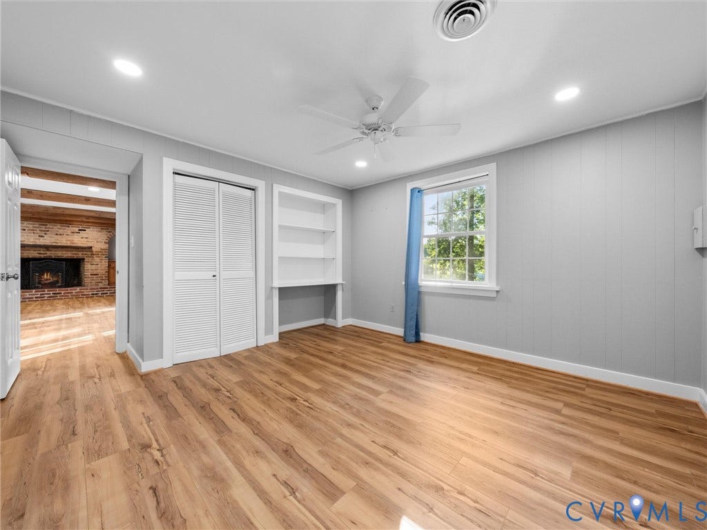Wood-finish flooring, recessed lighting, and a ceiling fan