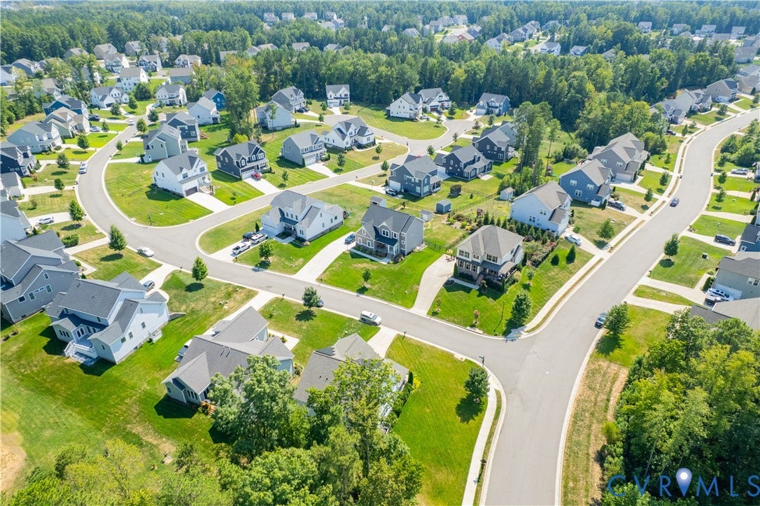 Residential neighborhood featuring curved streets, uniform lot sizes, and extensive green spaces