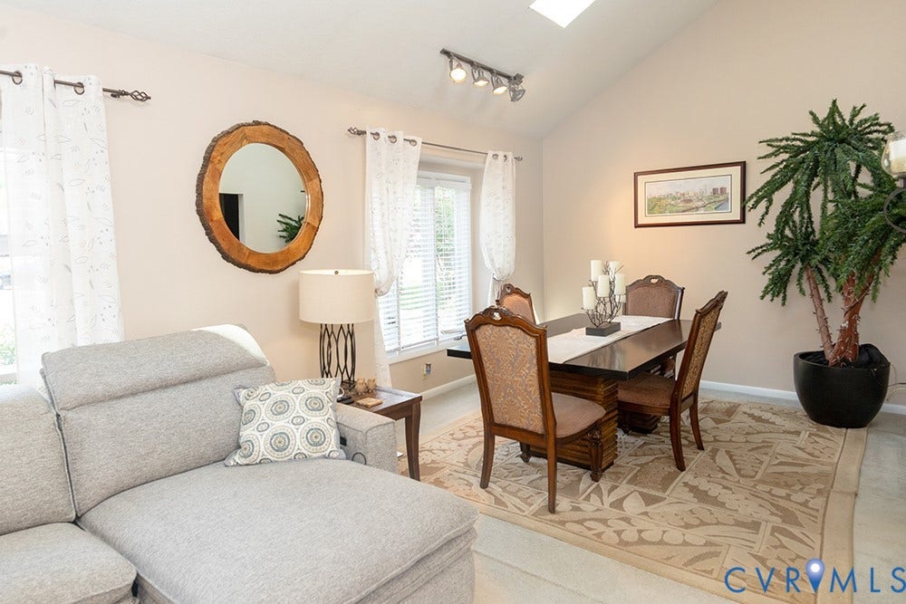 2209 Aspen Place, Henrico, VA 23233 Vaulted ceiling with skylight, track lighting, and window blinds