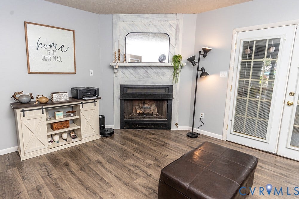 2209 Aspen Place, Henrico, VA 23233 Fireplace with a decorative mantel, wood-finish flooring, and white double French doors