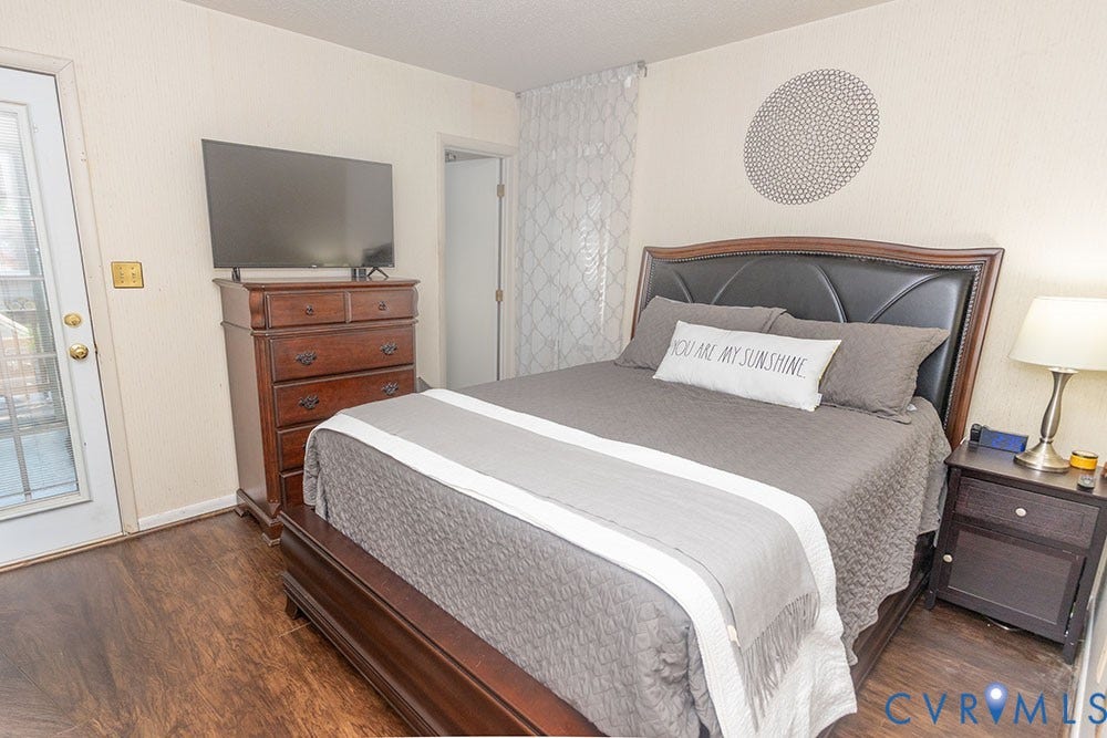 2209 Aspen Place, Henrico, VA 23233 Wood-finish flooring throughout, light-toned walls, and a glass-paneled door
