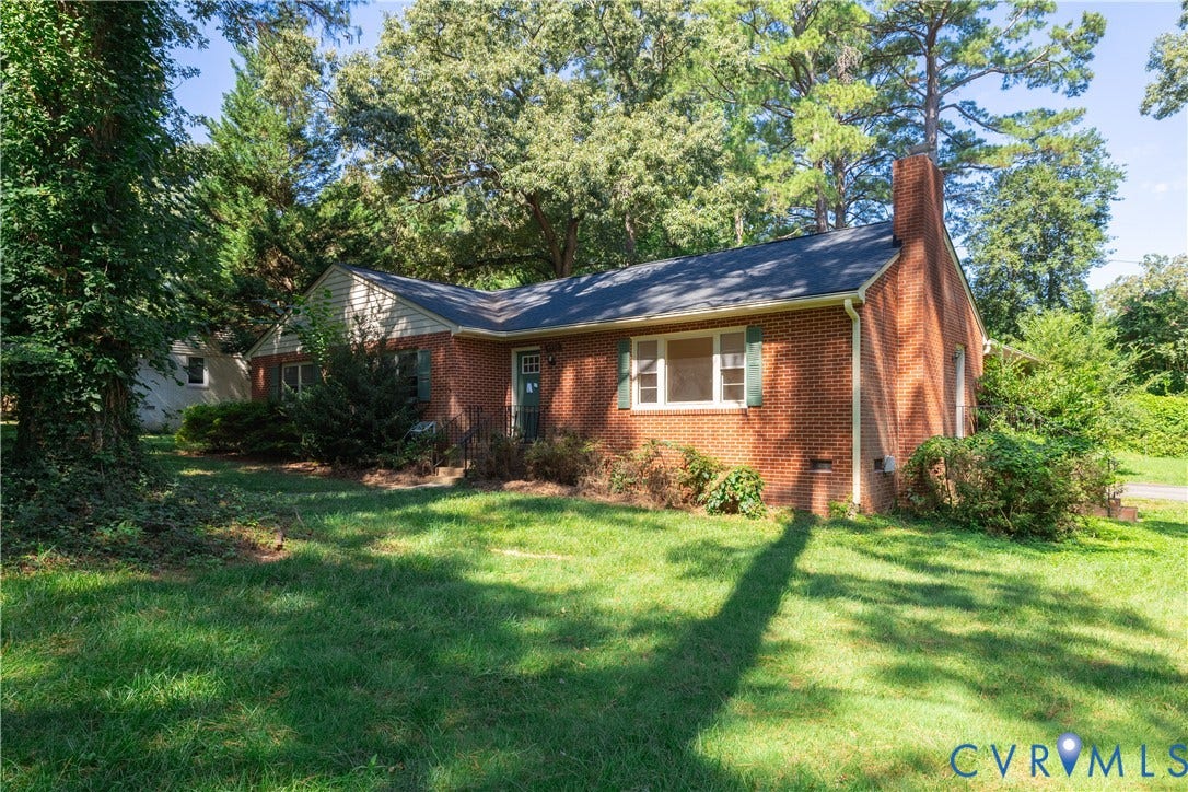 4532 Arrowhead Road, Statford Hills / Oxford, Richmond, VA 23235 Brick exterior with a prominent brick chimney, black roof, and green shutters