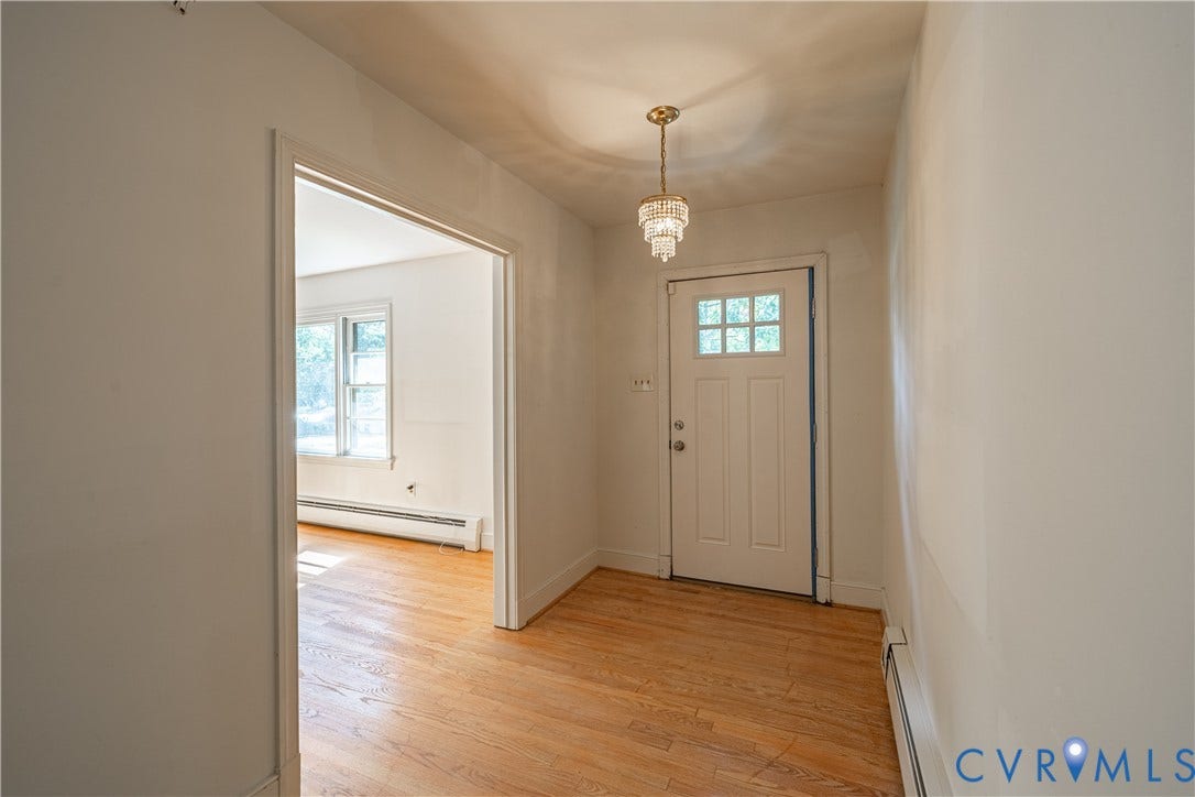 4532 Arrowhead Road, Statford Hills / Oxford, Richmond, VA 23235 Entryway with wood-finish flooring, a decorative chandelier, and a white paneled door with window lites