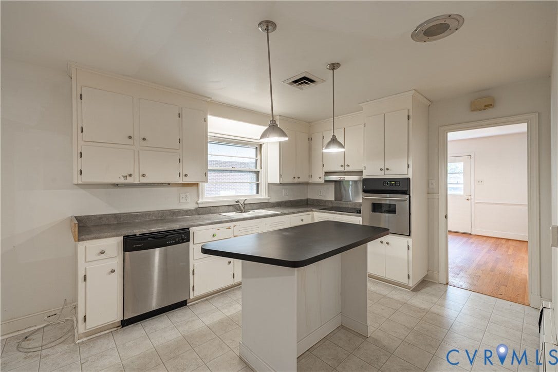 4532 Arrowhead Road, Statford Hills / Oxford, Richmond, VA 23235 Kitchen featuring white cabinetry, a built-in oven, stainless steel dishwasher, a center island, and tile flooring