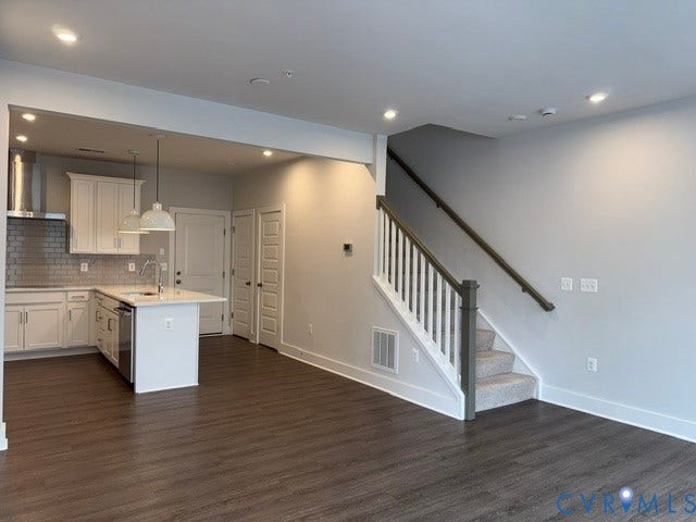 4113 Greybull Drive, #A, Gateway Square, Henrico, VA 23233 Open-concept living area featuring wood-finish flooring, recessed lighting, and a kitchen with white cabinetry, a center island with pendant lighting, and stainless steel appliances