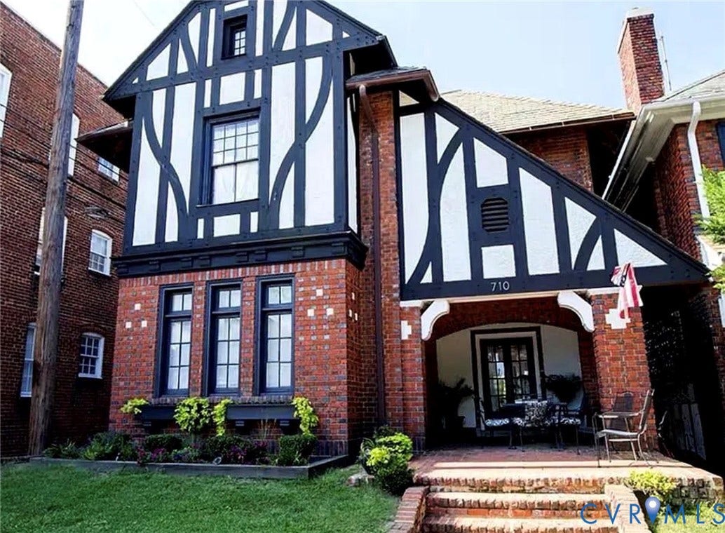 710 N Arthur Ashe Boulevard, Historic Fan District, Richmond, VA 23220 Tudor-style brick exterior with decorative half-timbering, an inviting covered front porch, and a brick-lined entryway