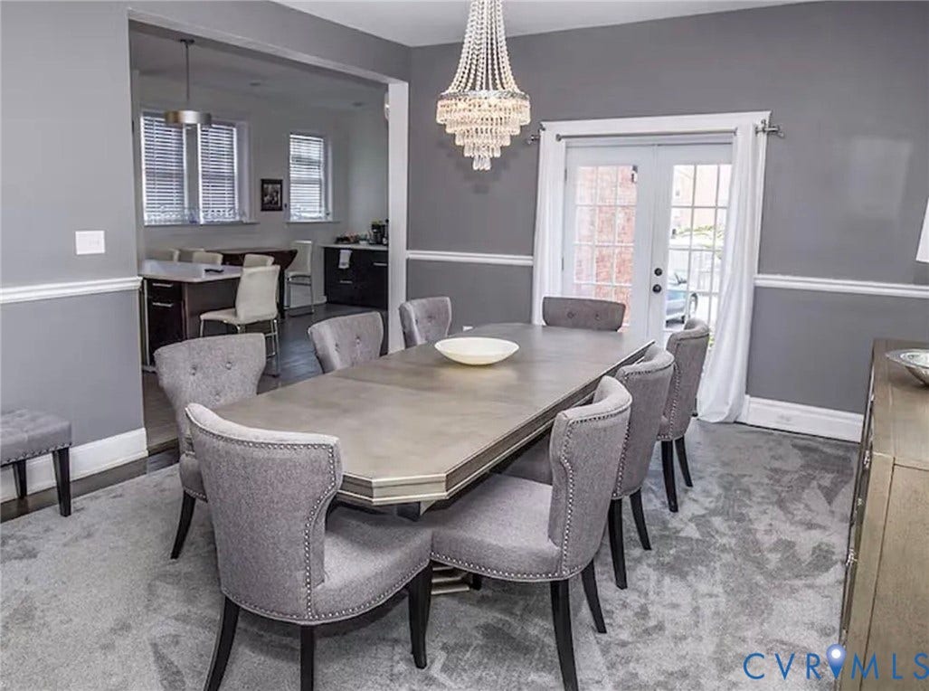 710 N Arthur Ashe Boulevard, Historic Fan District, Richmond, VA 23220 Recessed lighting, wood-finish flooring, white trim, and a built-in kitchen island with seating