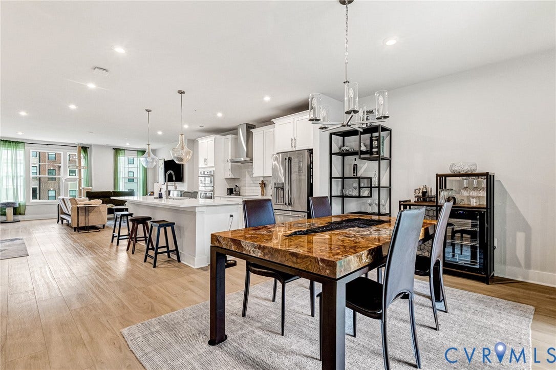 528 Greybull Walk, #B, Glen Allen, VA 23233 Open-concept living area with wood-finish flooring, recessed lighting, and a kitchen island with pendant lighting