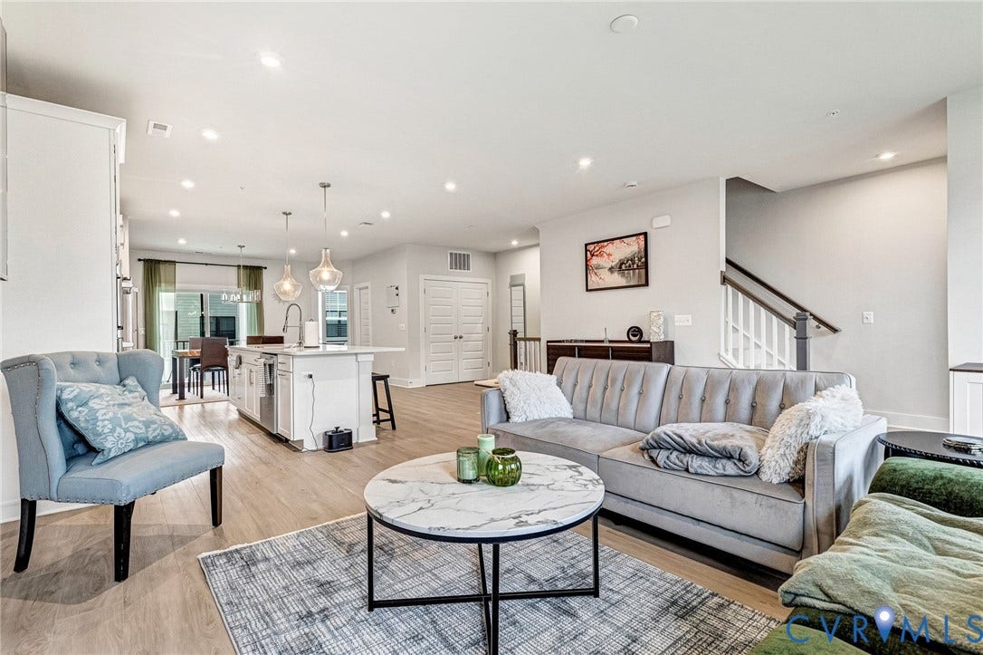 528 Greybull Walk, #B, Glen Allen, VA 23233 Open-concept living area with wood-finish flooring, recessed lighting, and a white kitchen island featuring pendant lighting and an undermount sink