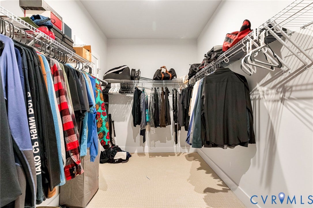 528 Greybull Walk, #B, Glen Allen, VA 23233 Walk-in closet featuring neutral carpeting, white walls, and wire shelving with multiple hanging rods
