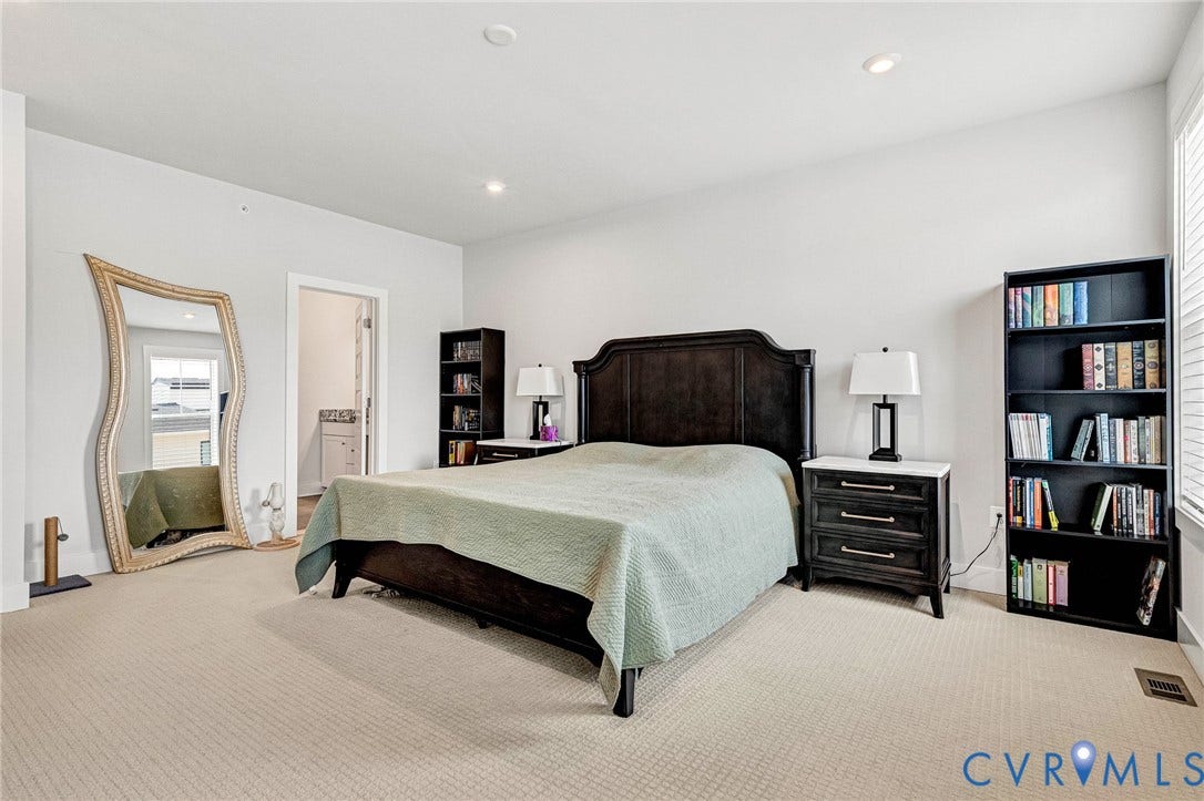 528 Greybull Walk, #B, Glen Allen, VA 23233 Recessed lighting, light-toned carpeting, dark wood-finish headboard, built-in shelving, and white interior walls