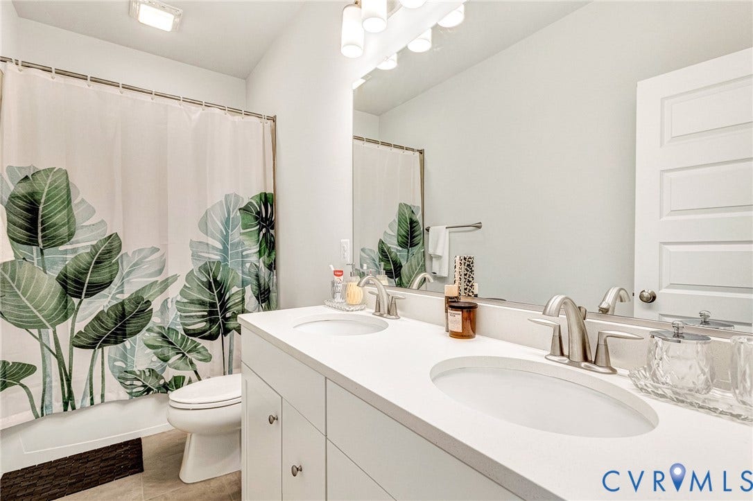 528 Greybull Walk, #B, Glen Allen, VA 23233 Double vanity with undermount sinks, brushed nickel fixtures, and a large mirror