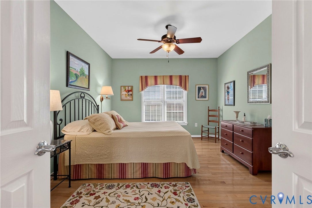 A versatile first-floor bedroom with hardwood floors and natural lightequally suited as a guest room or home office.