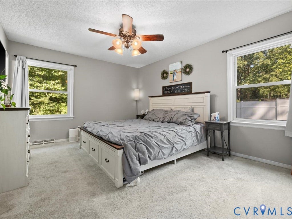 12724 S Chester Road, Chesterfield, VA 23831 Plush gray carpeting and a ceiling fan with two windows