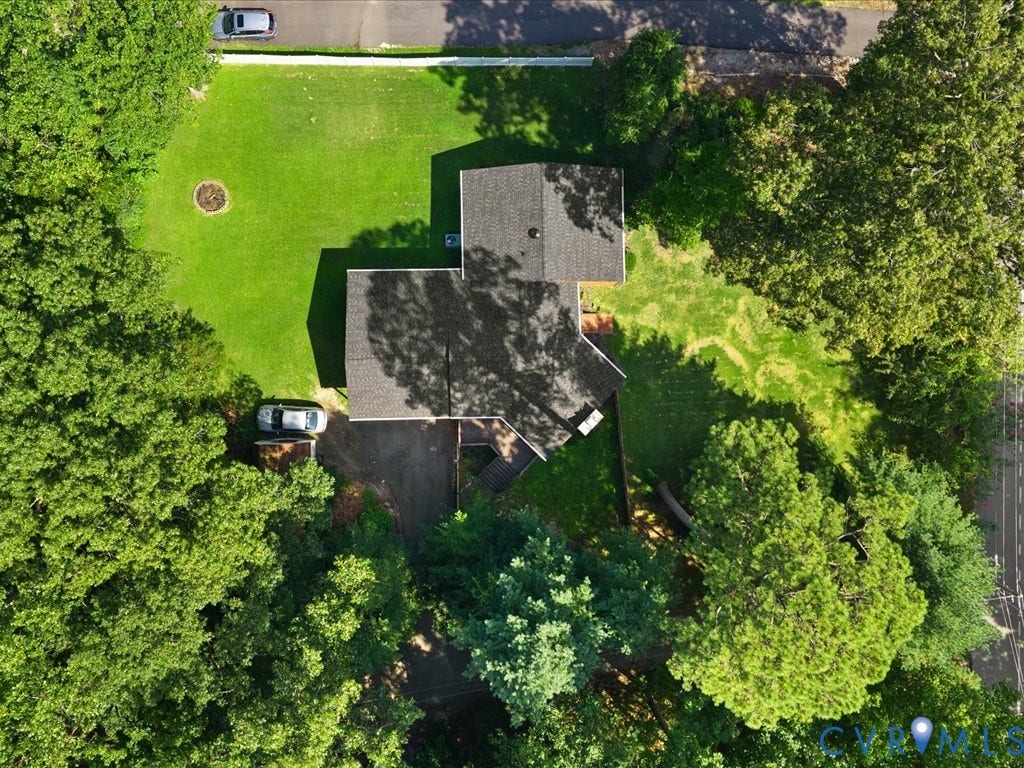 12724 S Chester Road, Chesterfield, VA 23831 Expansive lawn surrounds the residence, complemented by mature trees and paved driveway