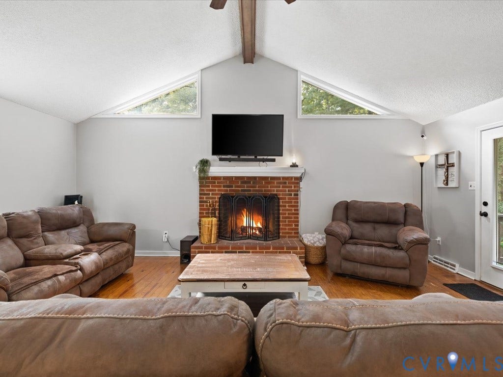 12724 S Chester Road, Chesterfield, VA 23831 Vaulted ceilings with exposed wood beams, brick fireplace with triangular transom windows