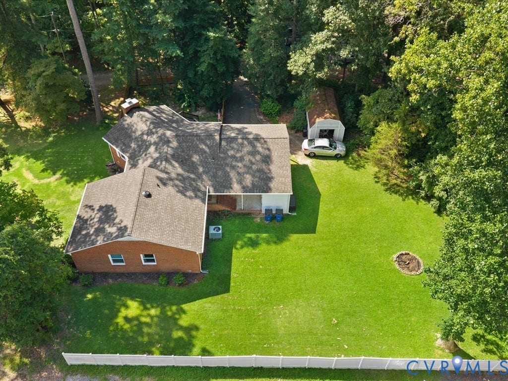 12724 S Chester Road, Chesterfield, VA 23831 Larger than it looks! Brick exterior, new shingled roof, expansive green lawn, built-in fire pit, storage shed