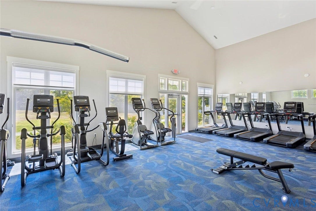 Premium community amenities featuring a fully equipped, modern fitness center just steps away.