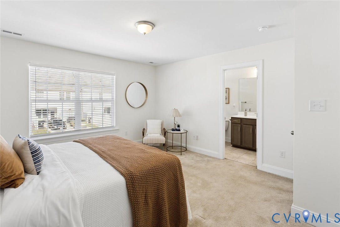 Carpeted flooring, a window with blinds, and a flush-mount ceiling light