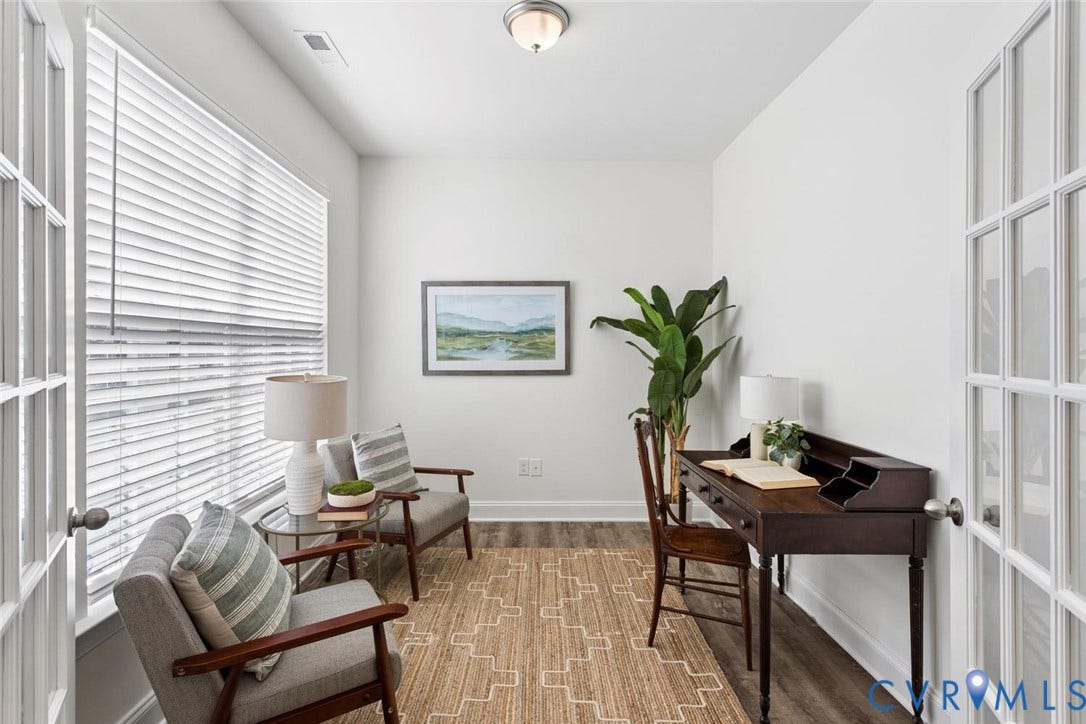 French doors with glass paneling, wood-finish flooring, white walls, large window with blinds, and a flush mount light fixture