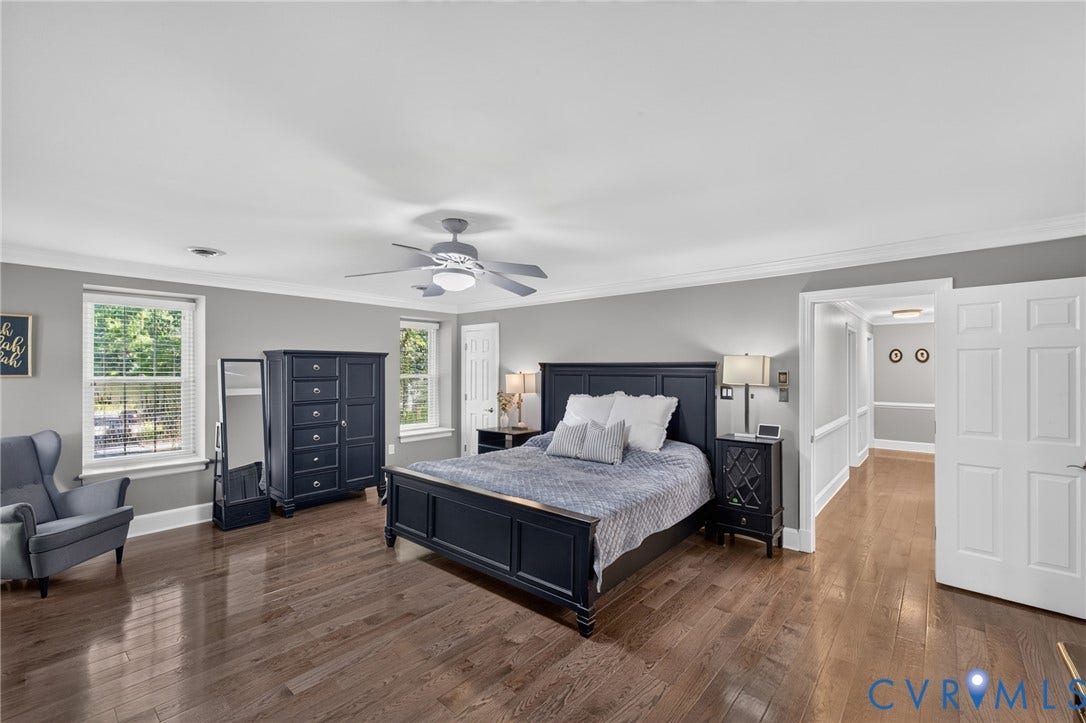12800 Leffingwell Court, Henrico, VA 23233 Hardwood flooring, crown molding, double windows with blinds, ceiling fan with light fixture, and a paneled door