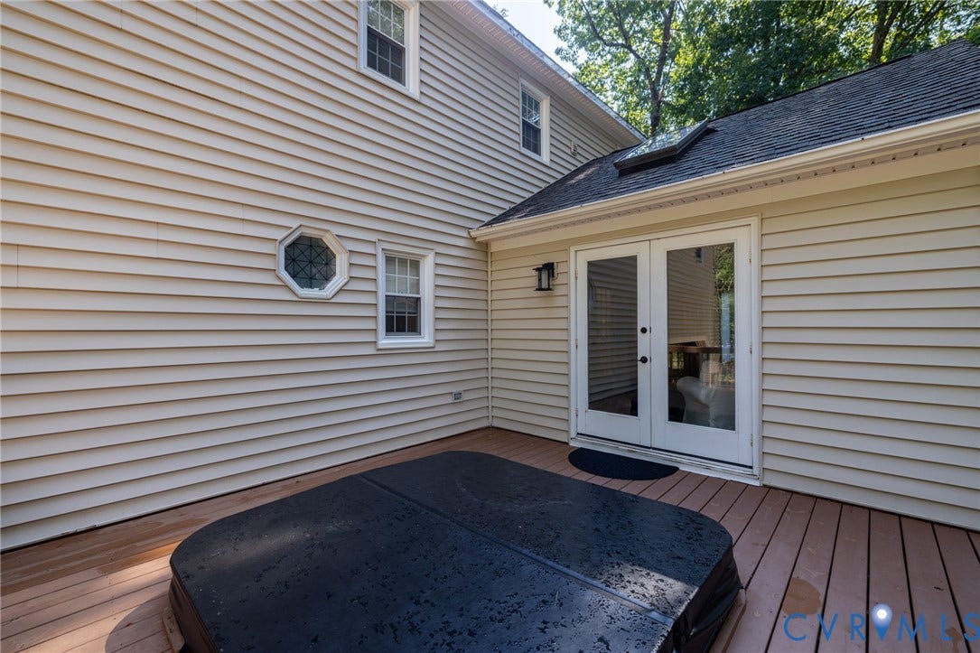 12800 Leffingwell Court, Henrico, VA 23233 Wood-finish deck with an integrated hot tub and dual French doors
