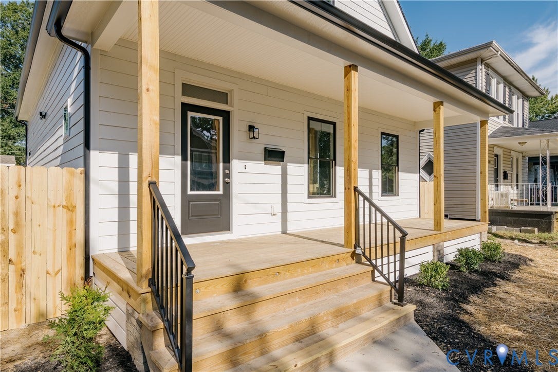 3106 Groveland Avenue, Richmond, VA 23222 Front porch with wood-finish decking, black metal railings, and natural wood posts