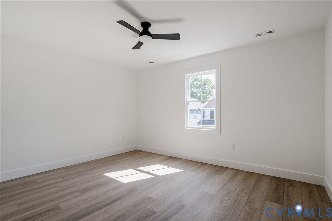 3106 Groveland Avenue, Richmond, VA 23222 Recessed lighting and a matte black ceiling fan complement the wood-finish flooring