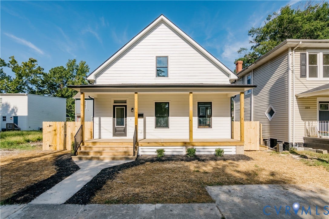3106 Groveland Avenue, Richmond, VA 23222 White horizontal siding exterior with a covered porch, wood plank porch flooring, and black framed windows