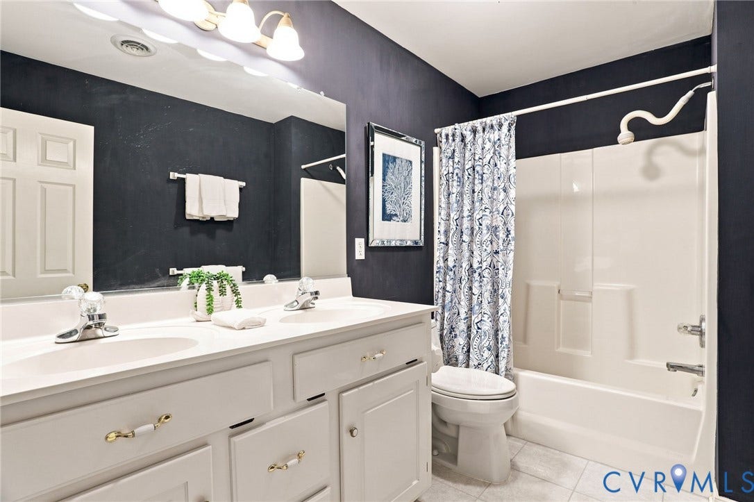 5712 Stephens Point Court, Stephens Point, Chester, VA 23831 Full bathroom features a double-sink vanity and tub/shower combination.