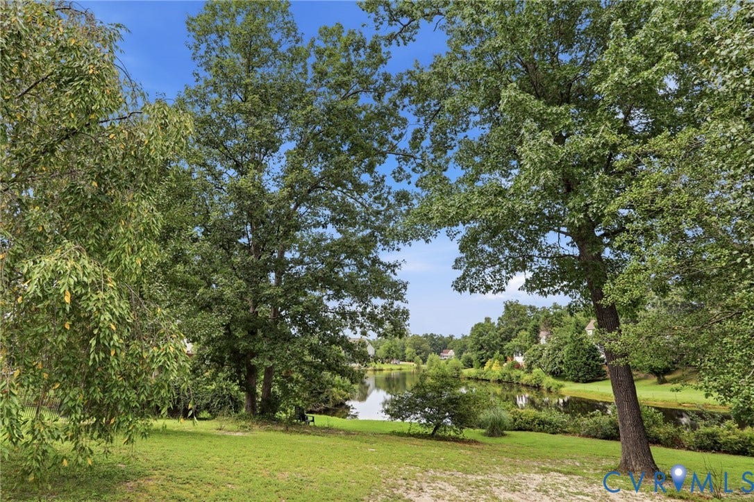 5712 Stephens Point Court, Stephens Point, Chester, VA 23831 Serene waterfront backdrop offers beautiful views and a peaceful natural setting just beyond the backyard.